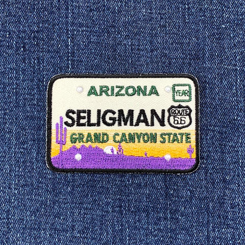 Embroidered patch with Seligman, Arizona design on denim fabric
