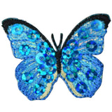 A blue butterfly applique patch with mini sequin shimmery embroidery.