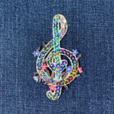 Decorative music note patch with sequins on denim fabric