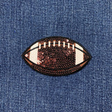 Sequined football patch on denim fabric