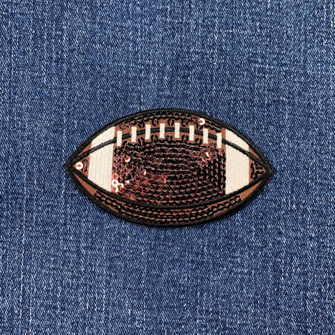 Sequined football patch on denim fabric