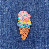 Sequined ice cream cone patch on denim fabric