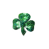 Green sequin shamrock on a white background