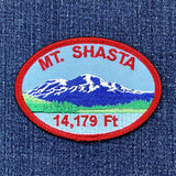 Embroidered patch of Mount Shasta on a denim background