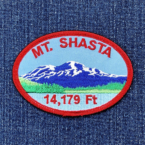 Embroidered patch of Mount Shasta on a denim background