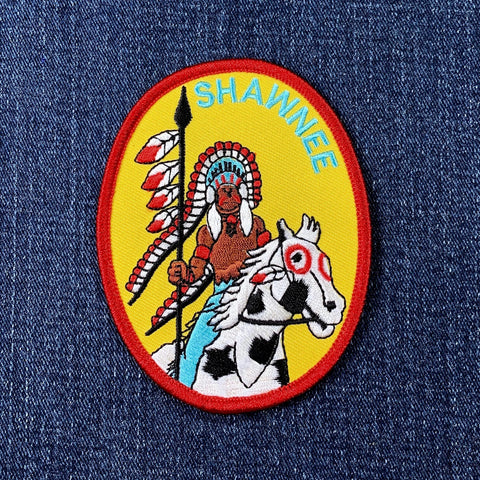 Patch with a Native American chief and horse on a denim background