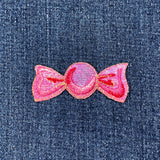 Pink candy patch on denim fabric