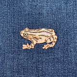 Frog patch on a denim background