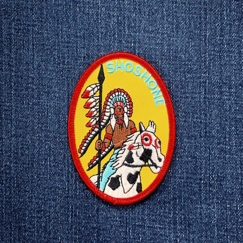 Patch with an Shoshone Indian chief and horse on a blue denim background
