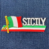 Embroidered patch with Italian flag design and 'SICILY' text on denim fabric.