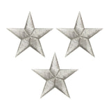 three silver star patches on a white background