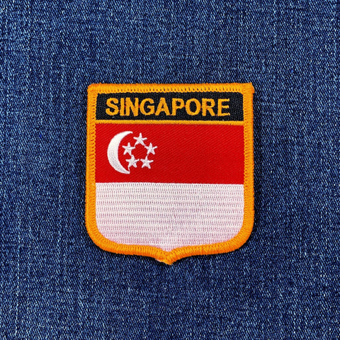 Singaporean flag patch on a blue denim background