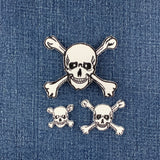 Skull and crossbones patches on a denim background