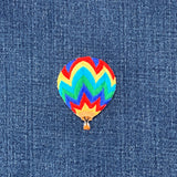 Colorful hot air balloon patch on denim fabric