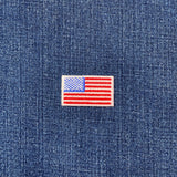 American flag patch on a blue denim background