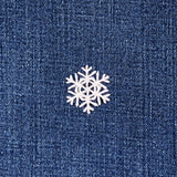 White snowflake patch on a blue denim background