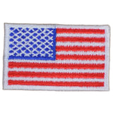Embroidered patch of the American flag on a white background