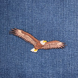 Embroidered eagle applique on denim fabric