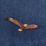 Embroidered eagle applique on denim fabric