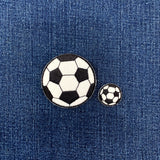 2 soccer ball patches on a denim background