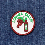 Sonoma Valley patch with grapes and wine bottle on denim fabric