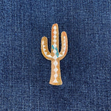 Embroidered cactus patch on denim fabric