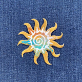 Decorative sun patch design on denim fabric