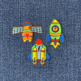 Colorful space-themed patches on denim fabric