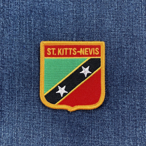 Patch with 'St. Kitts-Nevis' text on a blue denim background