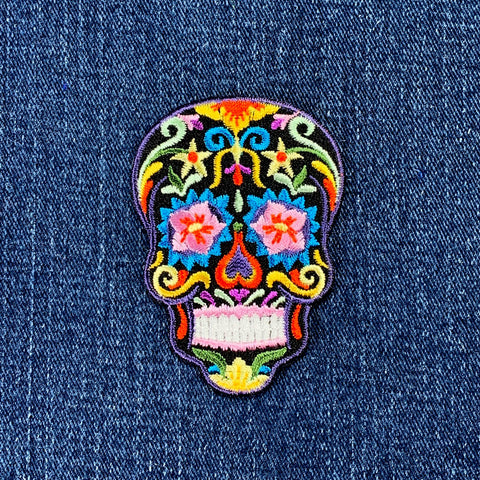 sugar skull patch on a denim background