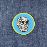Skull patch with colorful design on a blue denim background