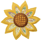 a patch depicting a sunflower with layered yellow shimmery fabric and brown center