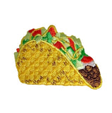 Embroidered patch of a taco with lettuce, tomato, and cheese on a white background