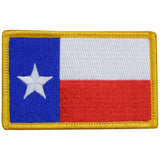 Embroidered patch of the Texas flag with a white star on a blue and red background.