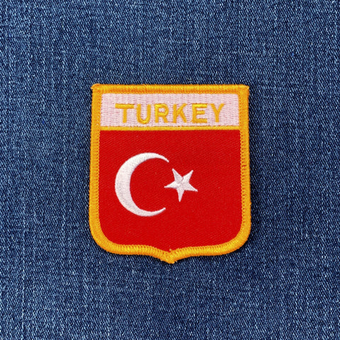 turkey flag shield patch on a denim background