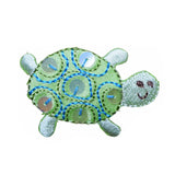 turtle patch with embroidered details on a white background