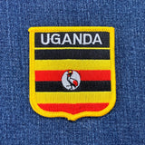 Uganda flag patch on a blue denim background
