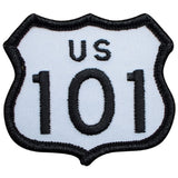 A shield-shaped embroidered patch featuring the text 'US 101' in black on a white background with a black stitched border.