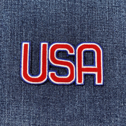 Embroidered 'USA' patch on denim fabric