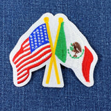 Patch with crossed American and Mexican flags on a denim background