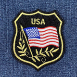 Embroidered patch with American flag and 'USA' text on denim fabric