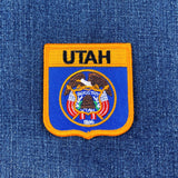Utah state emblem patch on a denim background