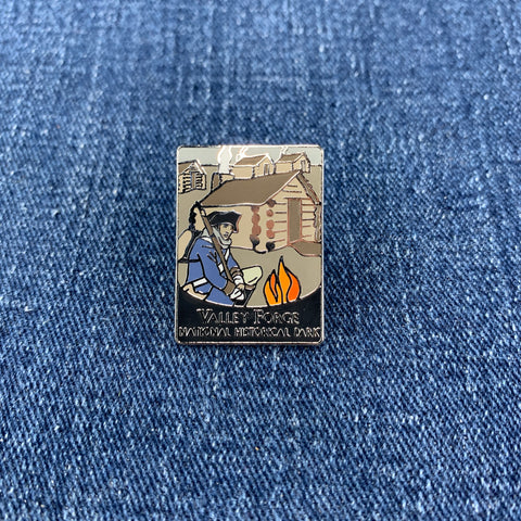 A collectible pin featuring the text 'Valley Forge National Historical Park' on a denim background.