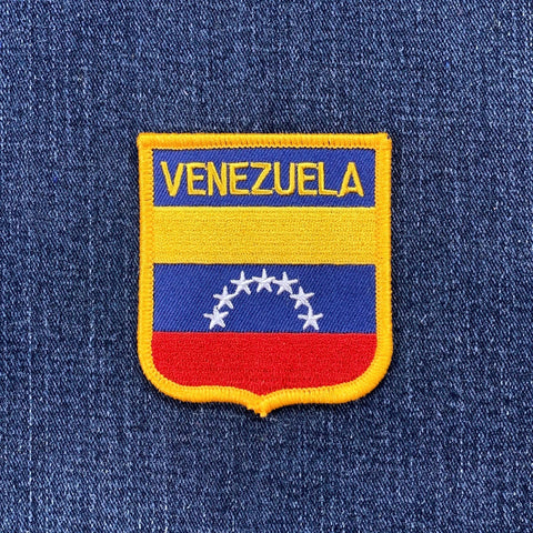 Venezuelan flag patch on a blue denim background