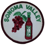 A circular embroidered patch featuring a cluster of dark red grapes and a bottle of red wine against a white background. The words 'SONOMA VALLEY' are stitched in green text around the top curve.