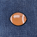 Football patch on a denim background