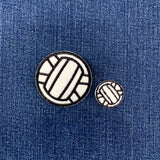 2 volleyball patches on a denim background