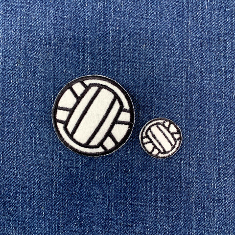 2 volleyball patches on a denim background