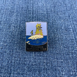 Pin with Voyageurs National Park design on a denim background