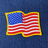 wavy usa flag patch on a denim background